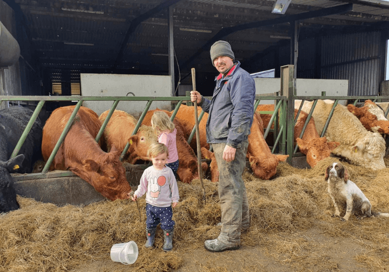 Brian Farrell, Head Farmer at Airfield Estate pictured on his home farm with his 2 daughters.