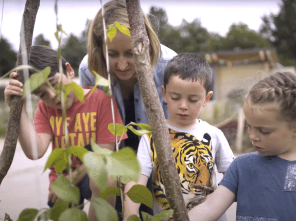 Mum with kids in the food garden